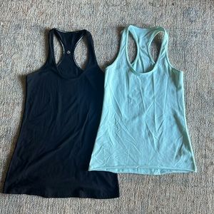 Lululemon reversible razorback tank tops in black and mint green size 4/6.